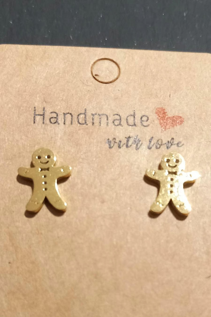 Gold gingerbread man earrings 